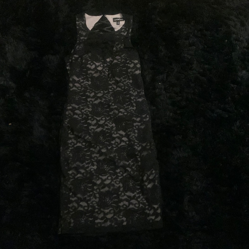Black lace bodycon dress, with nude underlay.